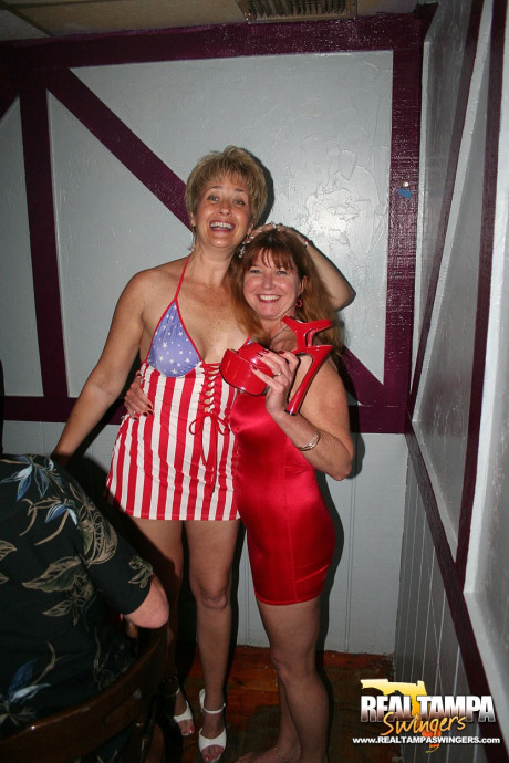 Playful amateur mature swinger wives teasing and French kissing at a party - #153910