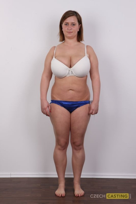 Thick mature amateur gets completely undressed in front of a white wall - #321575