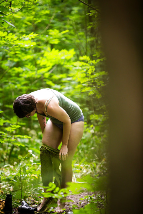 Voyeur snaps of undressed brunette whore chick in glasses getting dressed in woods - #130022