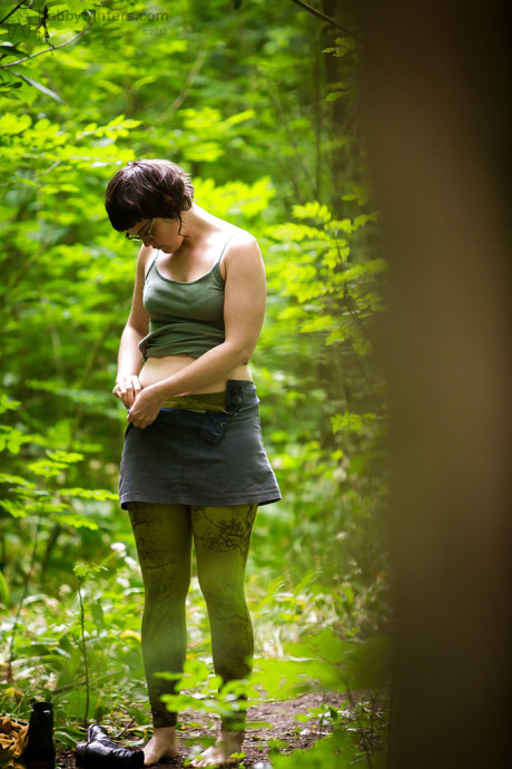 Voyeur snaps of undressed brunette whore chick in glasses getting dressed in woods - #130027