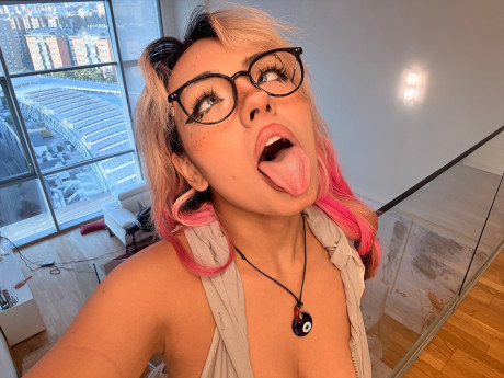 Hispanic teen with a enormous butt shows her large breasts in a thong and glasses - #316609