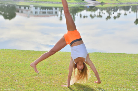 Pretty teen Serena doffs her clothes to show her behind and poses in a park - #218863