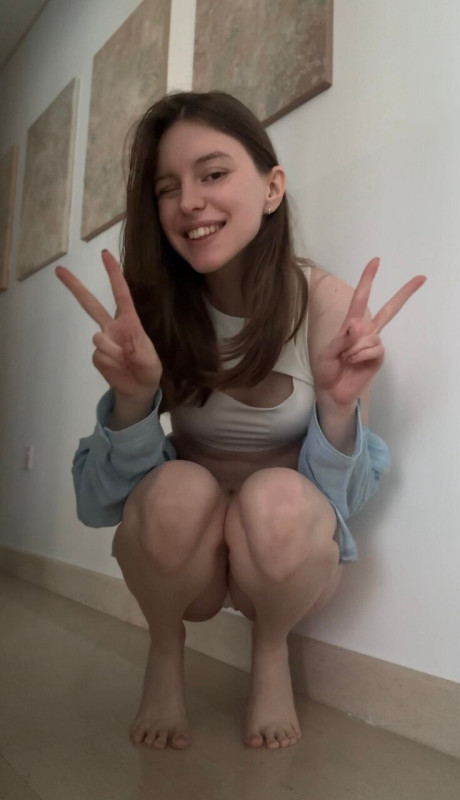 Brunette solo girl girl woman takes selfies while sporting denim attire