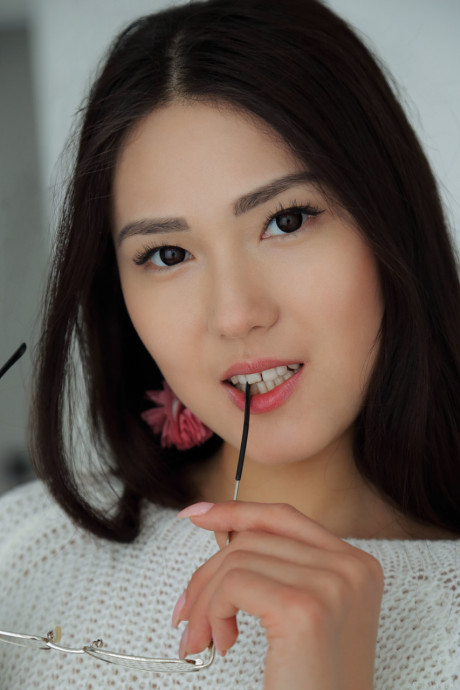 Adorable teen Kimiko unveils her attractive boobs and shaved vagina on a bed - #296455